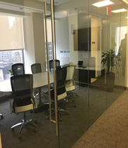 glass fronted conference room overlooking plaza district