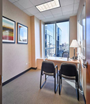 a private office space with chairs and a window near city hall new york city